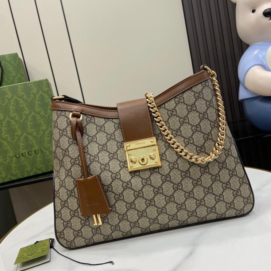 Borsa a tracolla media Gucci serie Padlock GG