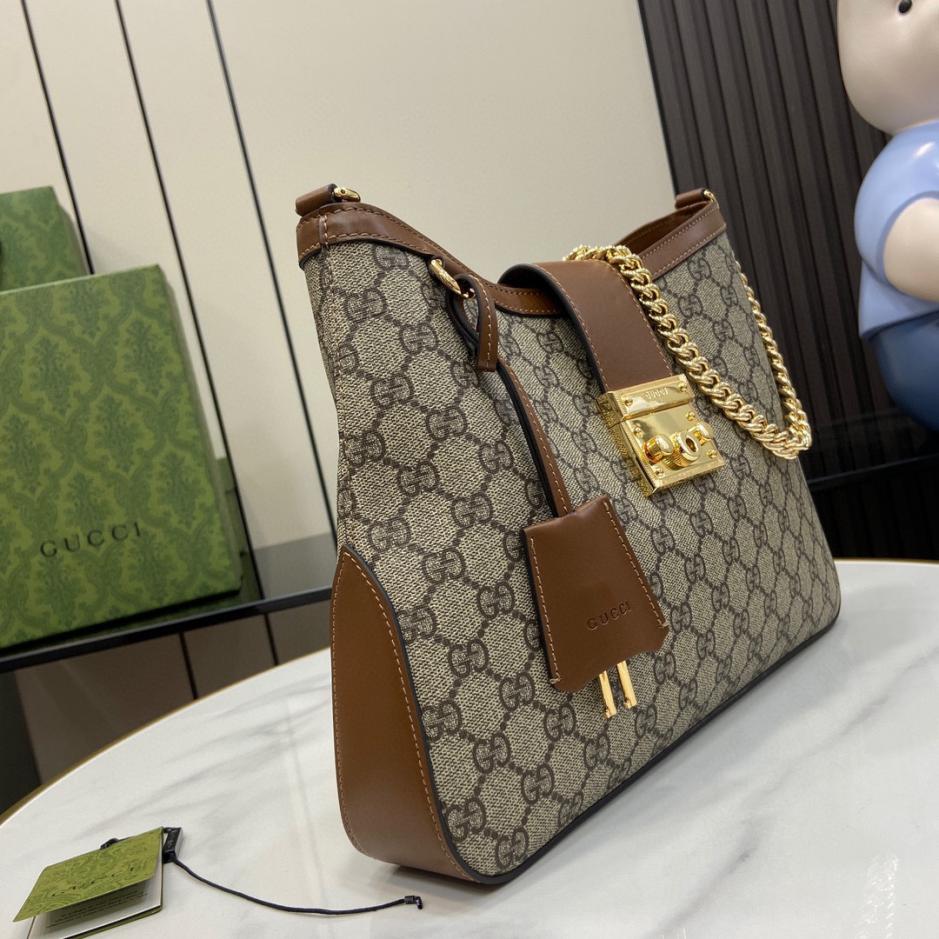 Borsa a tracolla media Gucci serie Padlock GG